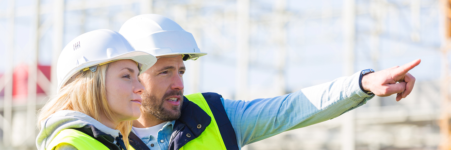 One Male and One Female engineer with hard hats and safety vests